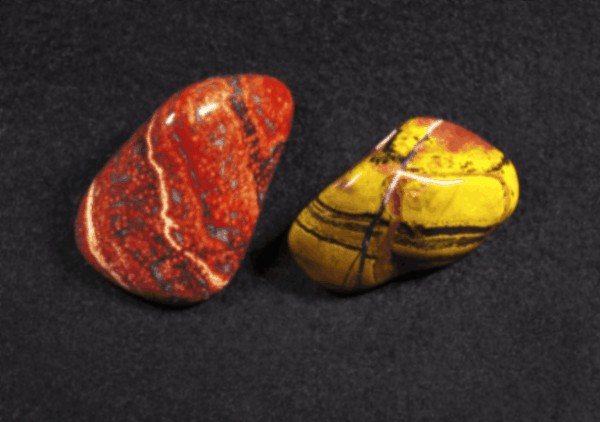 2 different colored jasper stones in tumbled form