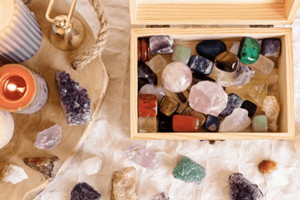 a box of various crystals showing some of the best crystals for manifesting used in energy work