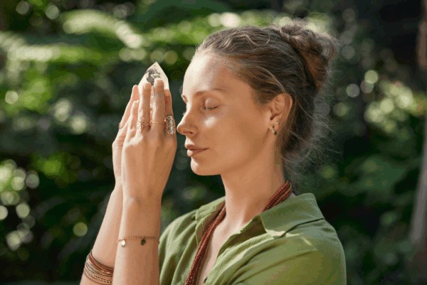 person with clear quartz on their third eye