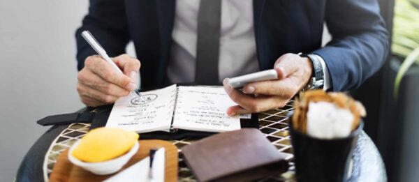 a person writing and wondering What Can You Write in a Future Self Journal