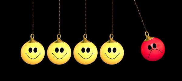 4 smiley face and 1 upset face symbols all hanging on a chain