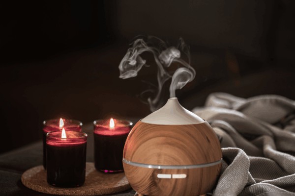 Candles and aromatherapy diffuser creating a peaceful space
