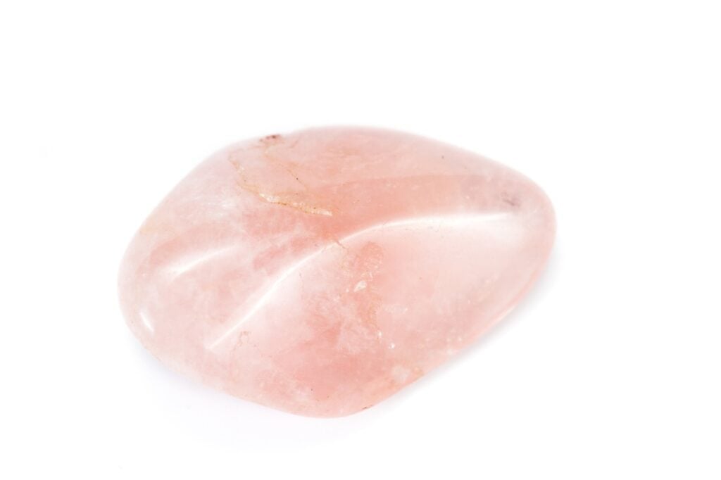 Tumbled piece of rose quartz crystal