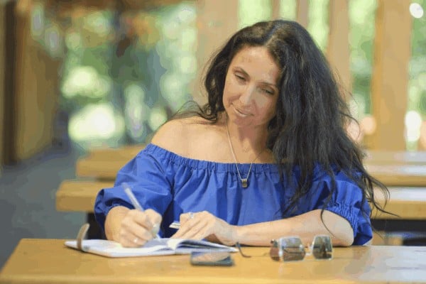 person journaling about their hypnosis journey
