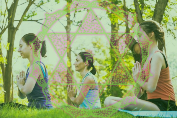 people outdoors balancing heart chakra energy