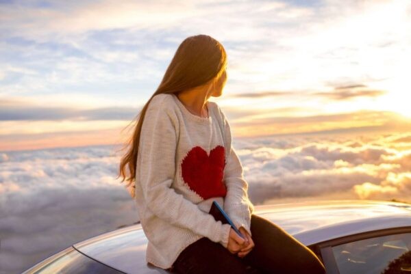 person near beach thinking whats heart chakra associated with