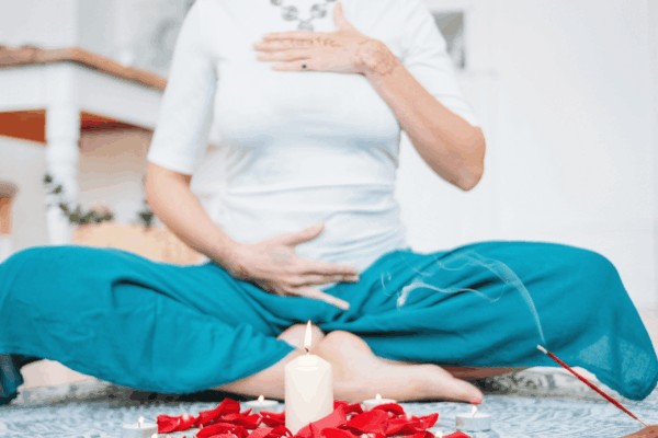 a person meditating feeling the subtle energy throughout their body, relating to this post called know your chakras image