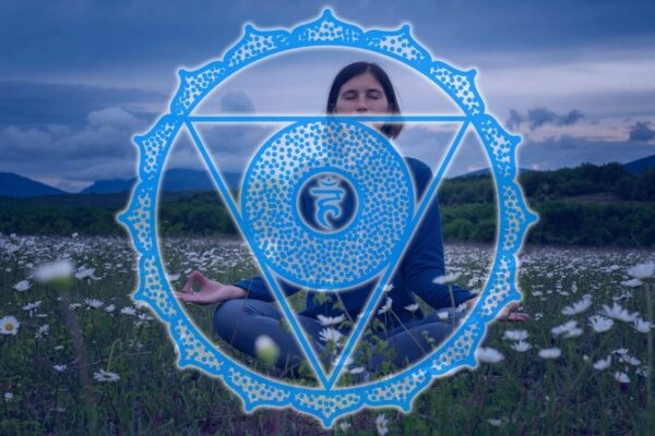 person meditating outdoors with throat chakra symbol around them