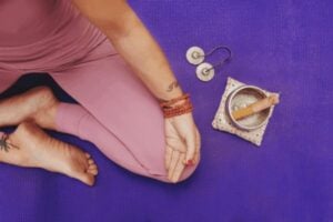 useful meditation tools for beginners near a person meditating