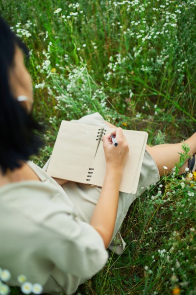 a person learning how to write intentions for manifestations