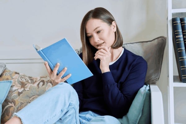 person reading their throat chakra affirmations