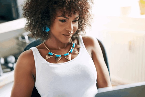 person wearing throat chakra jewelry, as blue necklace and ear rings